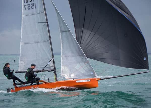 Itchenors Katie Nurton, with Nigel Ash, on her way to winning the Prince of Wales Cup with her International 14 off Hayling at the weekend