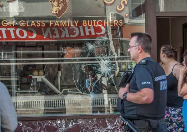 The window of Moran Bros. in Montague Street, Worthing has been smashed. Picture: Peter Pollack  www.filmonfilm.uk