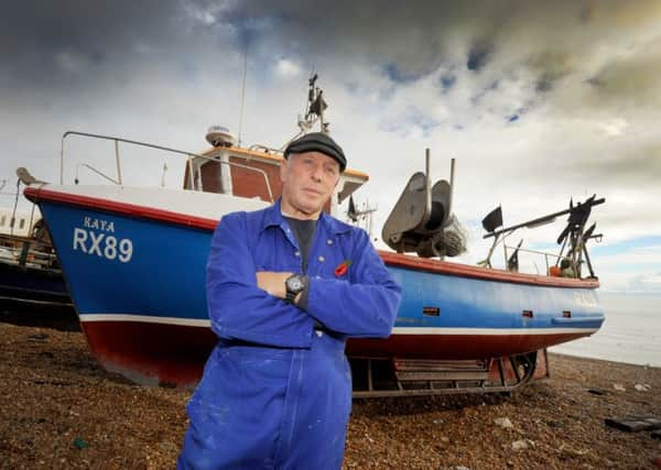 Paul Joy with his boat on Hastings Fishermen's Beach. SUS-150411-134401001