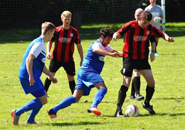 Shorehams newest recruit David OCallaghan challenges for the ball during his sides pre-season friendly with Southwick at Middle Road on Saturday