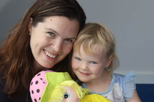 International Neighbours Day multicultural festival in Shoreham. Sophie Joseph and daughter Annabelle who won a doll. Photo by Derek Martin SUS-160625-202037008