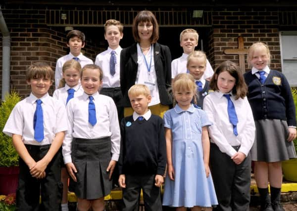 Marian Ham pictured with pupils at Sedlescombe Church of England Primary School. SUS-160630-135847001