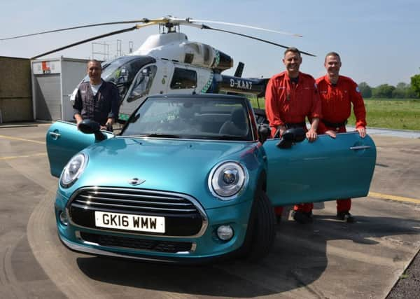 Air ambulance pilot Captain Kevin Goddard with paramedic Adam Ormrod and Dr Ed Clitheroe