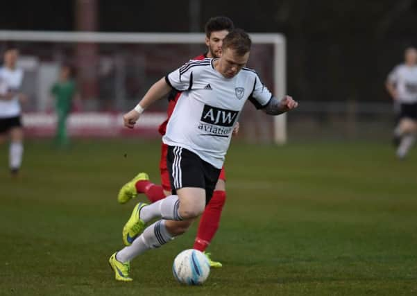 Loxwood's Charlie Pitcher in action against Hassocks. Picture by Phil Westlake SUS-160428-163816002