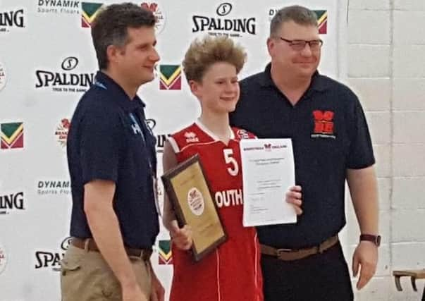 Ryan is pictured with basketball England officials receiving the award SUS-161107-185646001