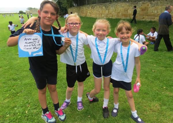 St Mary Star of the Sea Catholic Primary School pupils who ttok part in the Cancer Research UKs Race for Life Schools Programme. SUS-160720-102016001