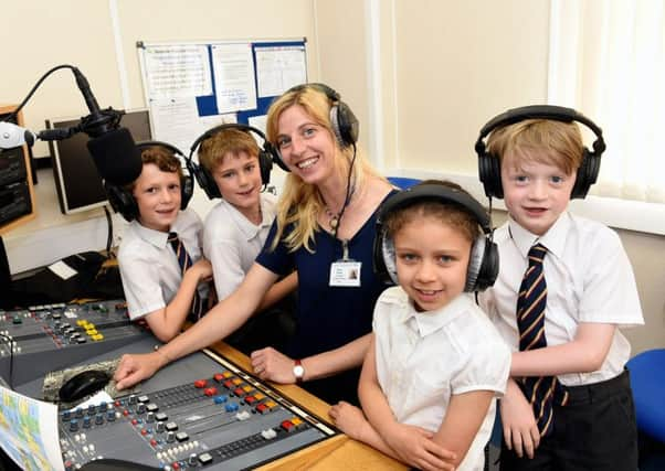 Josh Ferrett-Cohen, Isaac Hughes, Gabriela Duenasleon and Sam Hendry, with Gillian Fischer, hospital radio volunteer. Picture Liz Pearce lp1600218