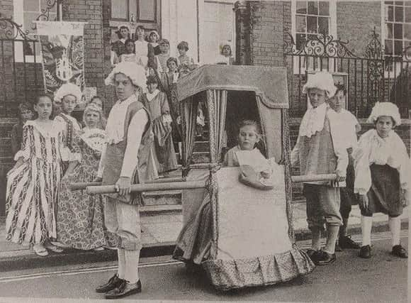 Schoolchildren take part in Georgian actitivites outside Pallant House