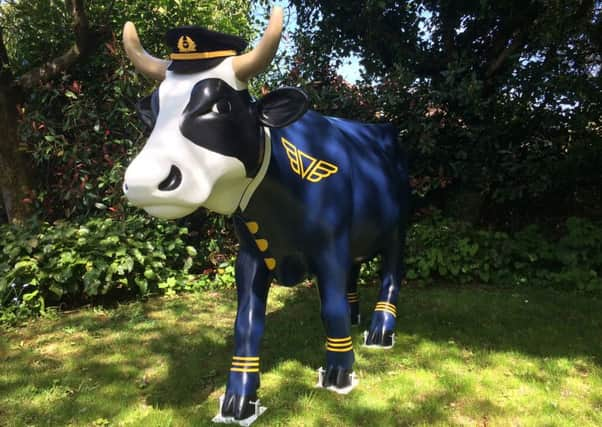 Lifesized fibreglass cow called Amoolia Earhart SUS-160727-163920001