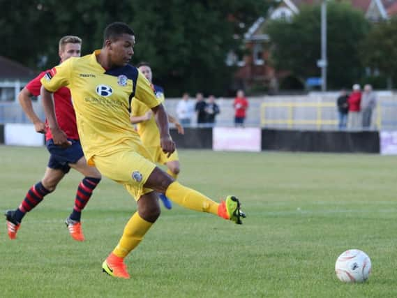 Hastings United forward Jack Harris scores his first goal in last week's 6-2 win away to Eastbourne Town. Picture courtesy Scott White