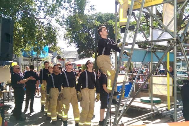 Firefighters took on a gruelling charity challenge in Horsham today