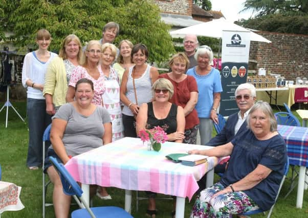 Organiser Laura Barioli, seated, left, and stallholders at Westbourne Horticultural Show Picture: Derek Martin DM16135637a