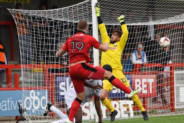 Crawley Town striker James Collins attacks the Barnet goal SUS-160821-001725002