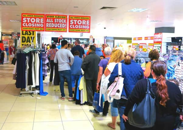 Shoppers bagging a bargain in the last day sales at BHS in Hastings. Photo by Michael Parmley SUS-160822-120355001