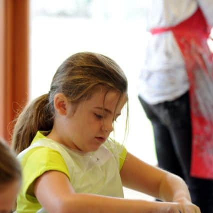 Kiera Turner-Reynolds, nine, creating a pot