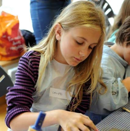 Chloe Peskett, nine, during the pottery workshop in the museum