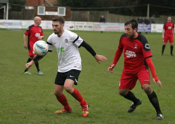 Horsham YMCA's Nick Sullivan (left) in action. Photo by Clive Turner SUS-160402-152117002