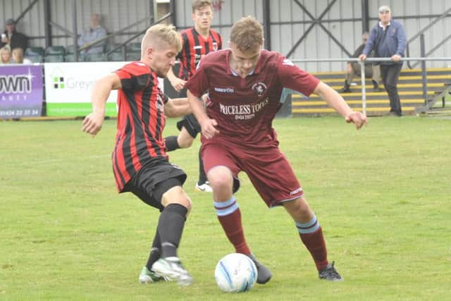 Harry Saville on the ball for Little Common against Oakwood. Picture by Simon Newstead