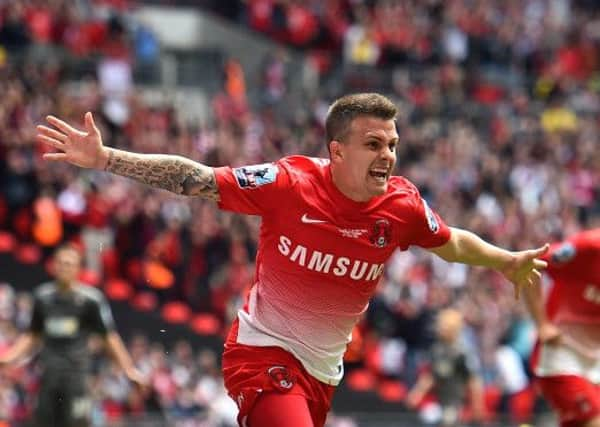 Dean celebrates scoring at Wembley last season SUS-150113-081637001