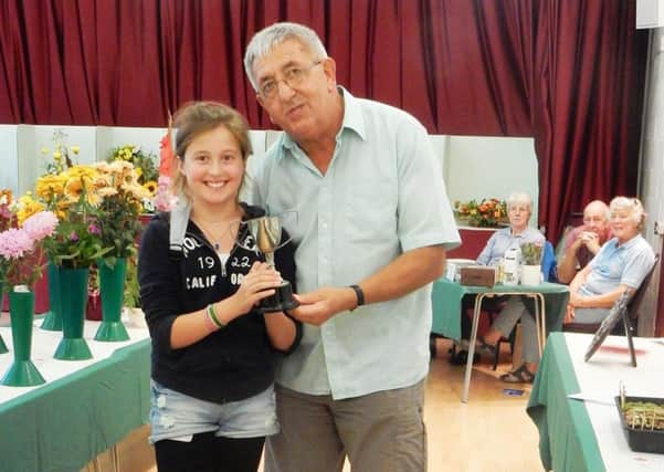 Charles Ashby presenting the Junior Challenge Cup to Daisy Martin