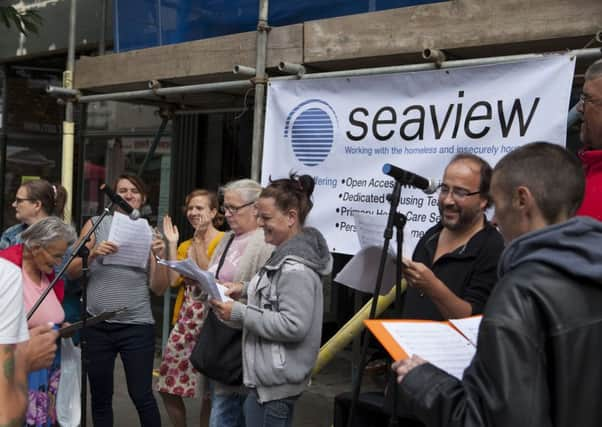 Participants prepare for their concert with a performance in the town centre SUS-160913-154555001