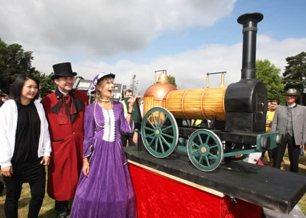 DM16144161a.jpg 175th anniversary of Haywards Heath station. The train cake, with Michelle Wibowo who made it and organisers Tim Riggs and Ruth de Mierre. Photo by Derek Martin SUS-160918-203228008