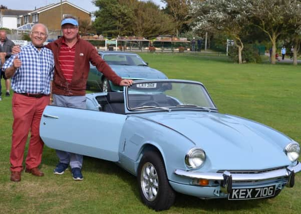 Organiser and local enthusiast Malcolm Buckett (left) standing with overall winner Roy Fairfull and his stunning Spitfire