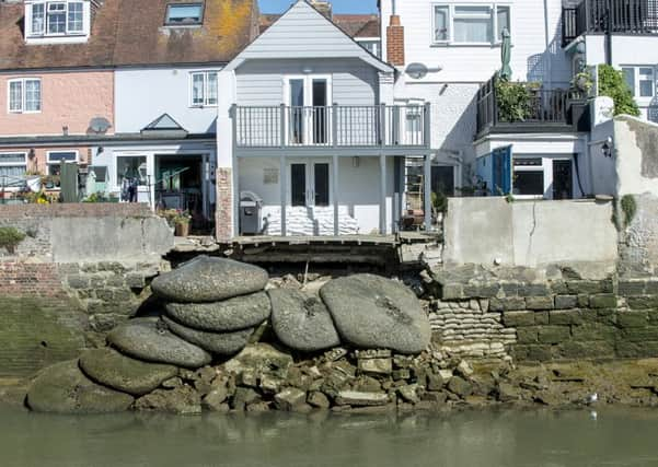 The extent of the damage to Johnny Boylan and Belinda Pickering's flood wall SUS-160914-172955001