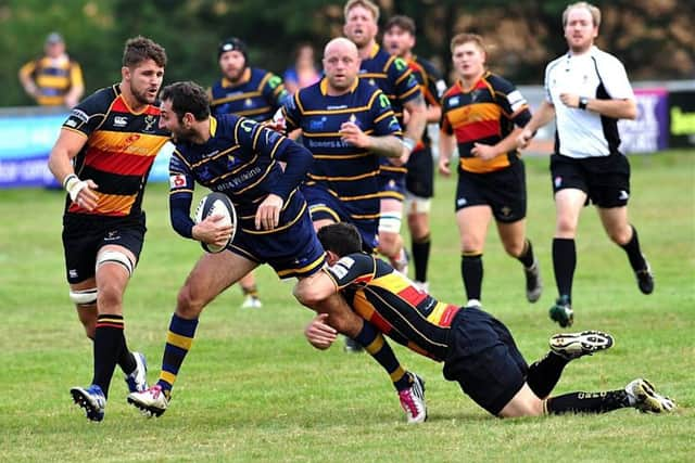 Alex Nielsen is tackled by a Cinderford player on Saturday. Picture: Stephen Goodger