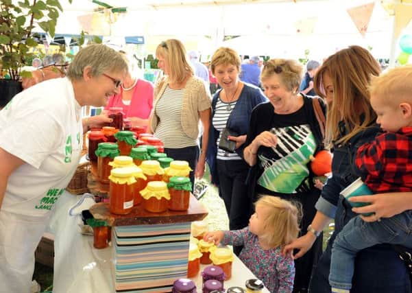 A busy stall at the MacMillan Coffee morning at Church Farm, Bosham