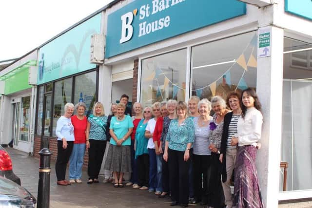 Shop staff and volunteers outside