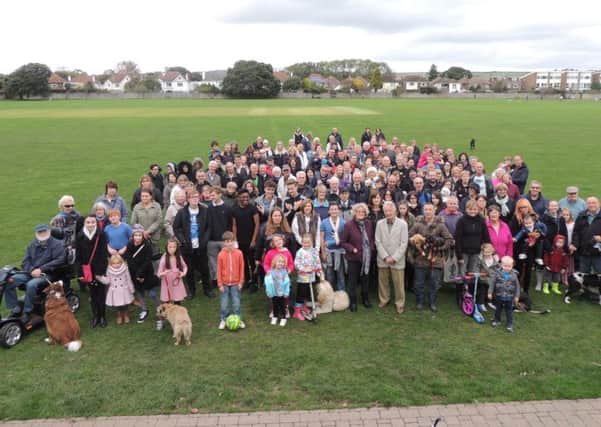 Residents gather at the Manor Sports Ground on Sunday to show their support to the action group. SUS-141027-124030001