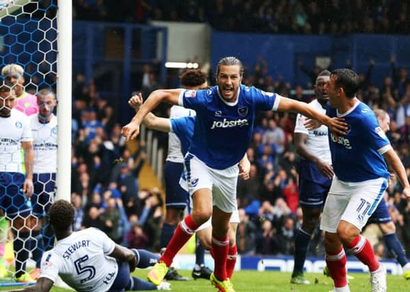 Christian Burgess celebrates scoring in the 4-2 win against Wycombe at Fratton Park in September. Picture: Joe Pepler