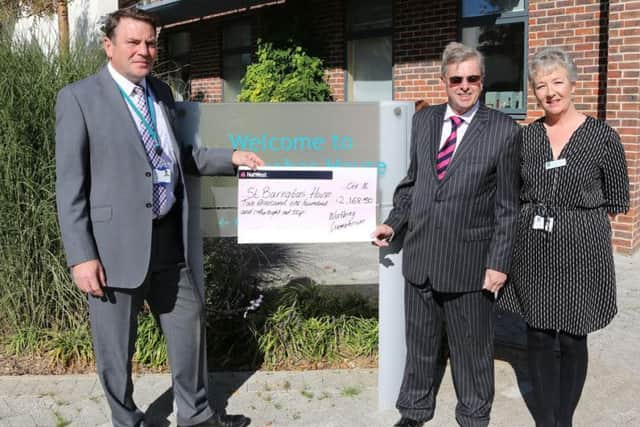 Hugh Lowson (Chief Executive St Barnabas House Hospice), Councillor Clive Roberts and Wendy Bardsley (St Barnabas House Hospice Community Fundraising Manager) with a cheque for Â£2,168.50