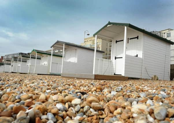 Beach huts on De La Warr Parade SUS-160927-135117001