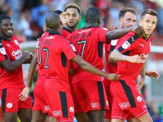 Crawley Town celebrate scoring a goal earlier in the season