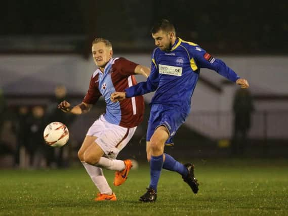 Simon Johnson tussles for possession during Hastings United's 1-1 draw at home to South Park on Saturday. Picture courtesy Scott White