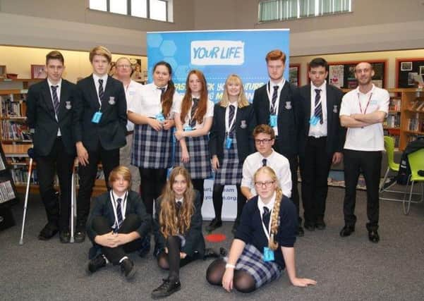 Year-ten students visiting the Game Wagon, back, from left, Ben Taylor, Matthew Bellamy, John Lilley, Katrina Neve, Cerys Davies, Daisy Andrews, James Barnes, Charlie Collins and Tony Higgs, front, from left, Sam Bell, Amy Franklin, Louis Adams and Kirsty Mead