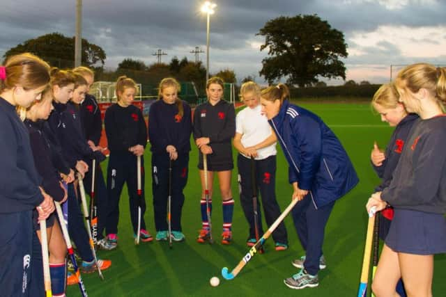 Giselle training with the U15 girls Hockey team