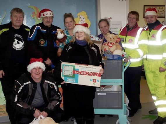 Service by Emergency Rider  Volunteers (SERV) team up with West Sussex Bikers' Motorcycle Club to deliver Toys to Sussex Children in Hospital over Christmas.

Conquest Hospital, Hastings. SUS-151228-090633001