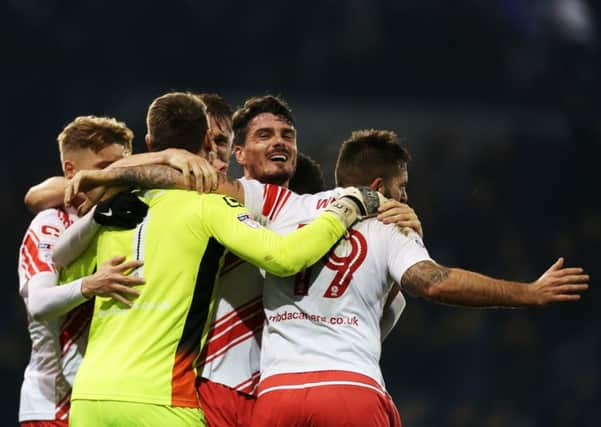 Stevenage's players celebrate victory over Pompey   Picture: Joe Pepler