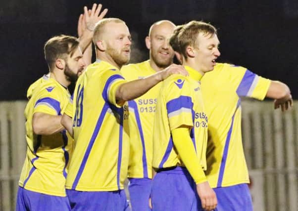 Langney Wanderers celebrate their goal against Crawley Town at the Oval