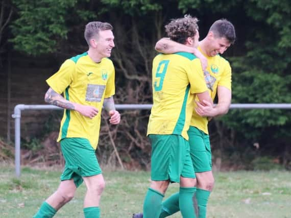 Zak Hurst, Callum Smith and Matt Dadswell celebrate one of Westfield's goals. Picture courtesy Joe Knight