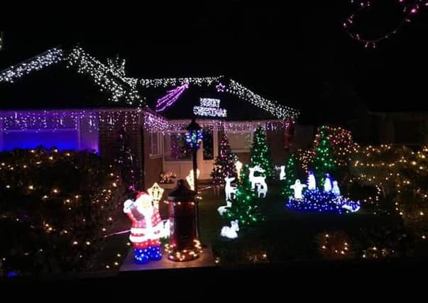 Debbie and Mark Scott, renowned for their impressive Christmas lights at their home in Windermere Crescent, were joined by Worthing mayor Sean McDonald and town crier Bob Smytherman for their switch on event. 78Ur0EN5E4ywGLY3X_ch