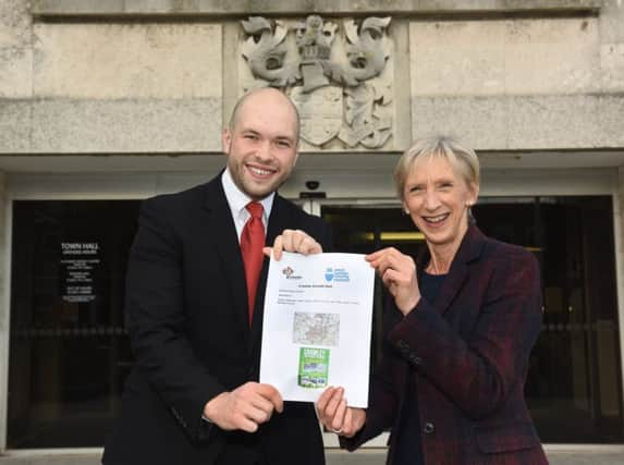 Peter Lamb and Louise Goldsmith with the Crawley Growth Deal. Picture by Jon Rigby. SUS-161223-121226001