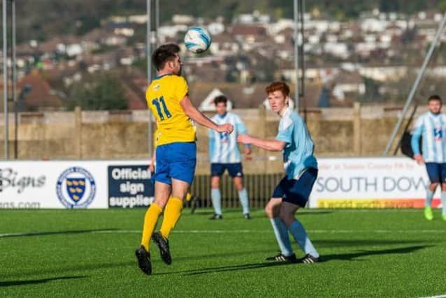 Lewis Finney nets Lancings fourth in their win against Worthing United. Picture by Kyle Hemsley