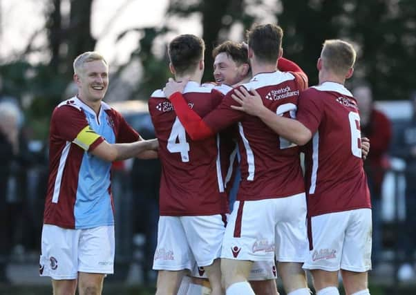 Hastings United celebrate their second goal against Lewes. Picture courtesy Scott White