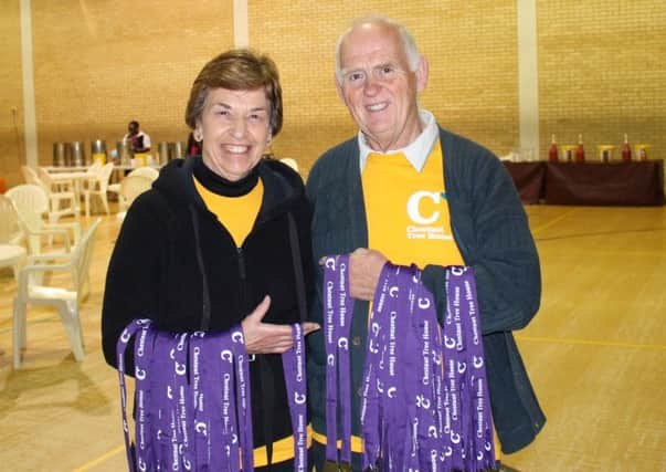 Gill Chapple handing out medals at Chestnut Tree children's hospice  Night to Remember. SUS-170301-154807001