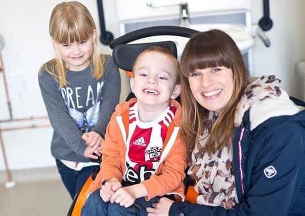 Sarah Brisdion, 37, with her six-year-old twins Ericka and Hadley