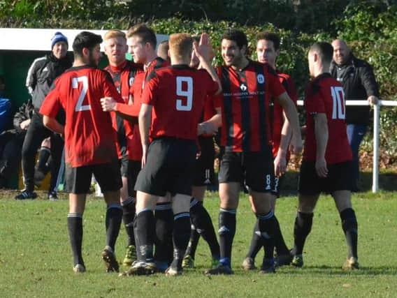 Heath celebrate a goal. Hailsham Town v Haywards Heath Town. Picture by Grahame Lehkyj